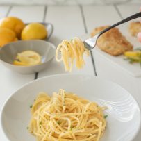 Lemon pepper spaghetti twirled around a fork