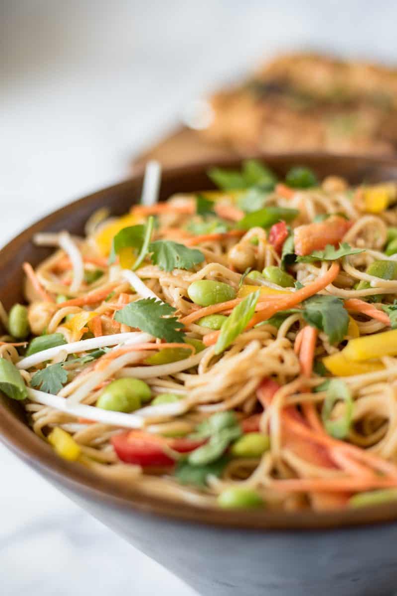 A closeup of the salad in a wood bowl