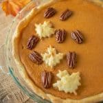 Pastry maple leaves and maple glazed pecans decorate the top of the pie