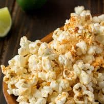 Yummy spices on top of popcorn with flecks of lime zest