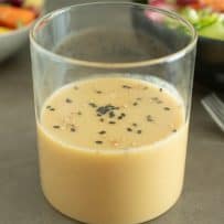 A glass container of miso dressing sauce and marinade