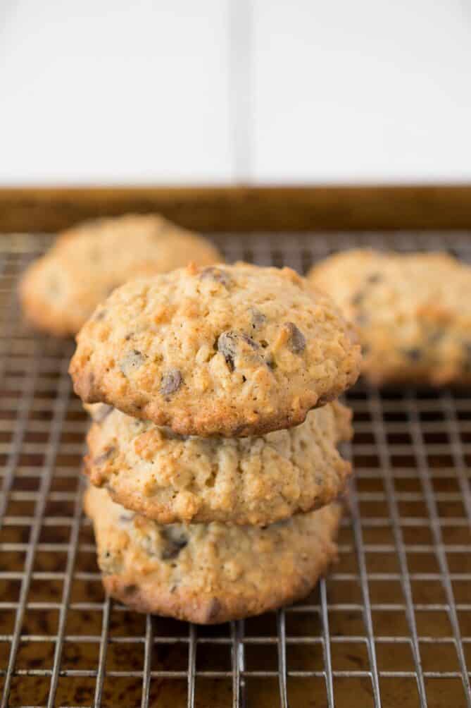 3 oatmeal cookies stacked on a cooling rack