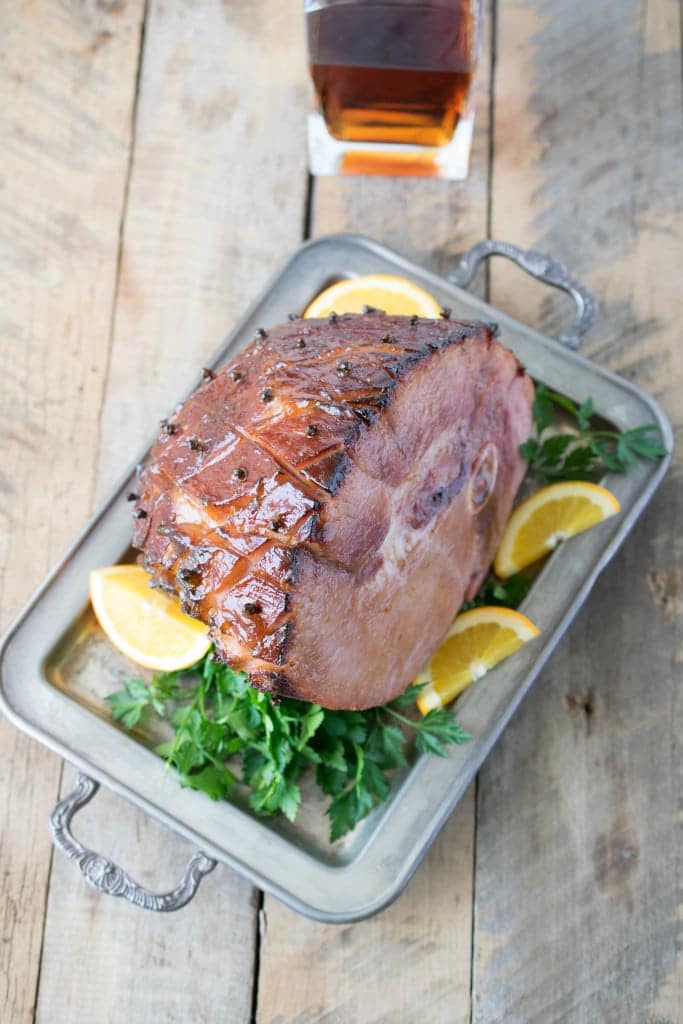 From overhead showing the clove studded skin of the ham