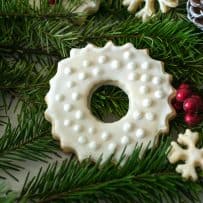A peppermint sugar cookies decorated with winter white on white frosting