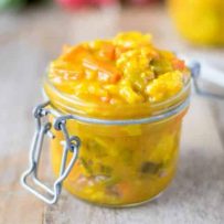 Piccalilli in a jar served with fresh radishes