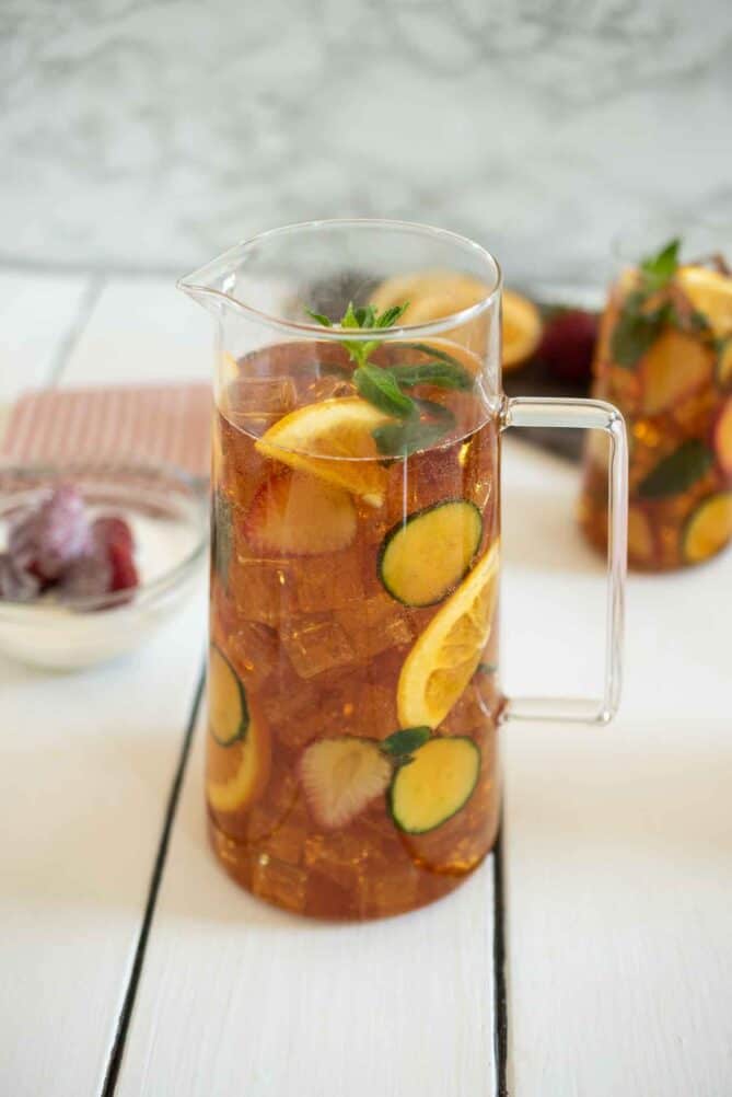 A large glass pitcher of a summer cocktail