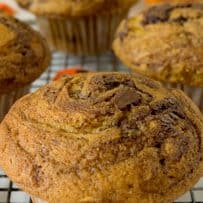 A closeup of a pumpkin muffin that has nutella swirled all through