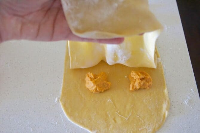 Fold fresh pasta dough to make ravioli