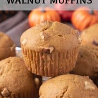 Golden brown pumpkin walnut muffins with crunchy pieces of walnut poking through