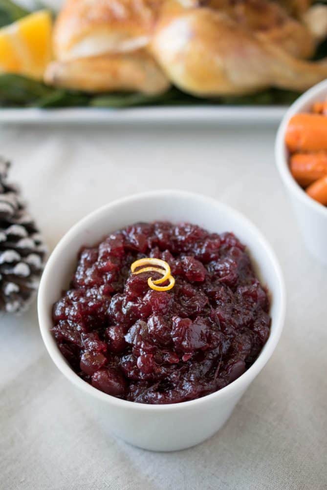 A closeup of cranberry orange sauce in a bowl that is very chunky