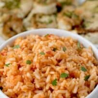 A white bowl filled with red with Mexican flavors