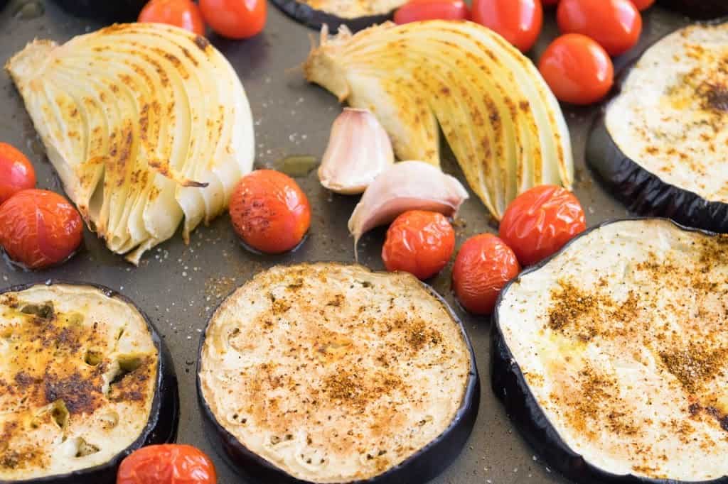 Roasted eggplant slices, onions, tomatoes and cherry tomatoes