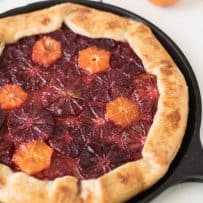 Sliced blood oranges and mandarins fill a fruit tart