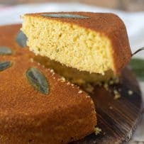 A slice of Sage Cornbread showing flecks of fresh sage on the inside