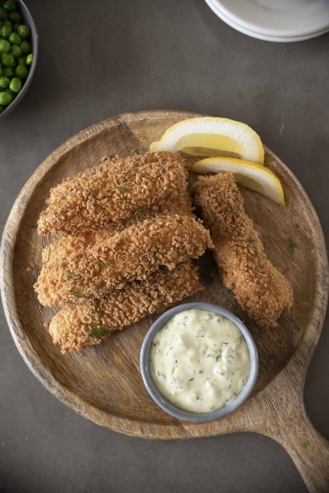 Breaded salmon sticks from overhead with tartar sauce