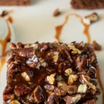 A piece of brownie on a white plate