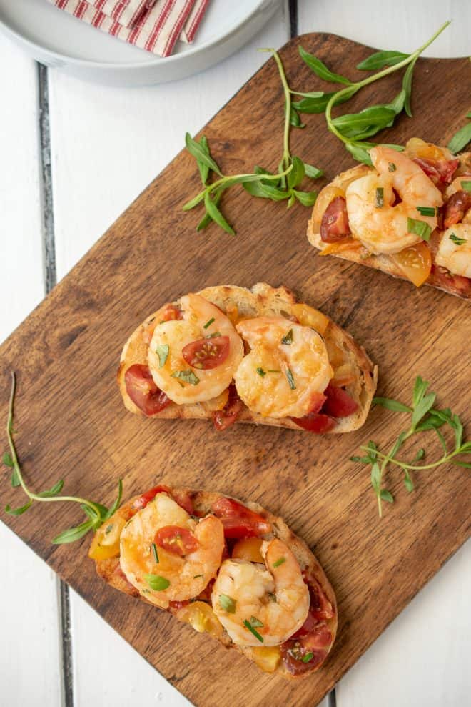 3 Shrimp and Cherry Tomato Bruschetta on a serving board