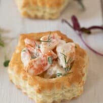 Shrimp salad with herbs inside a round puff pastry shell