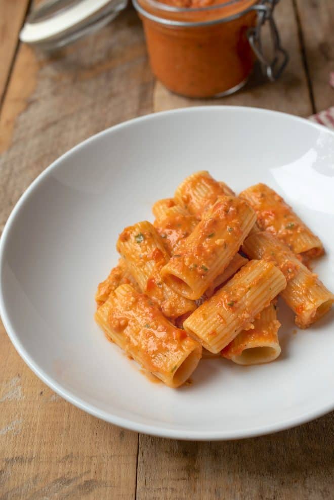 Rigatoni and Sicilian pesto sauce in a white bowl