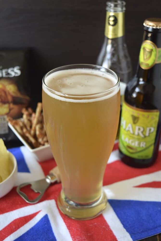 A tall pint glass of cider and lager