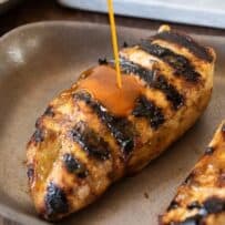 2 grilled chicken breasts with sauce