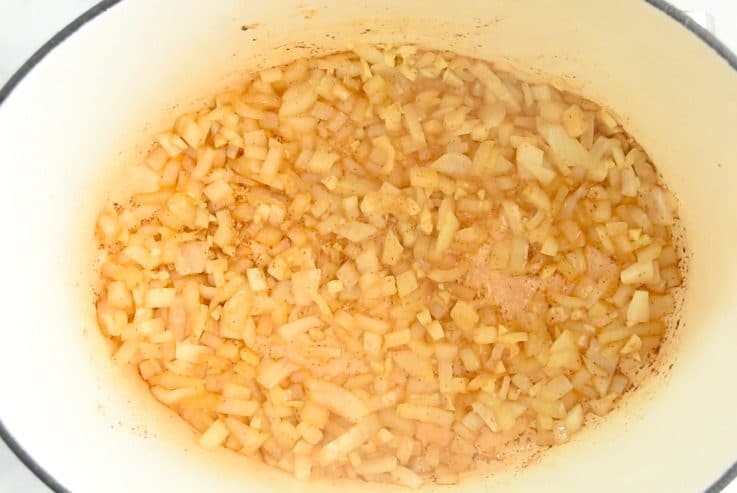 Onion and garlic cooking in a pan