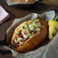 A Southwest Sonoran hot dog in a black bowl