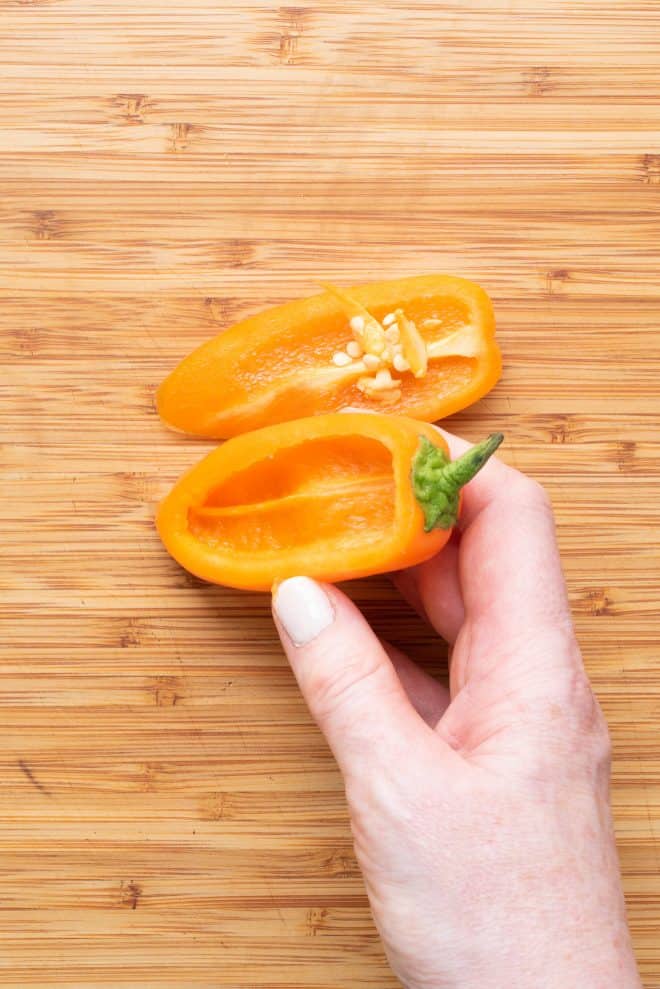 A mini sweet pepper sliced open with the seeds removed