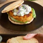 Veggie burgers with the top bun off and with the bun on