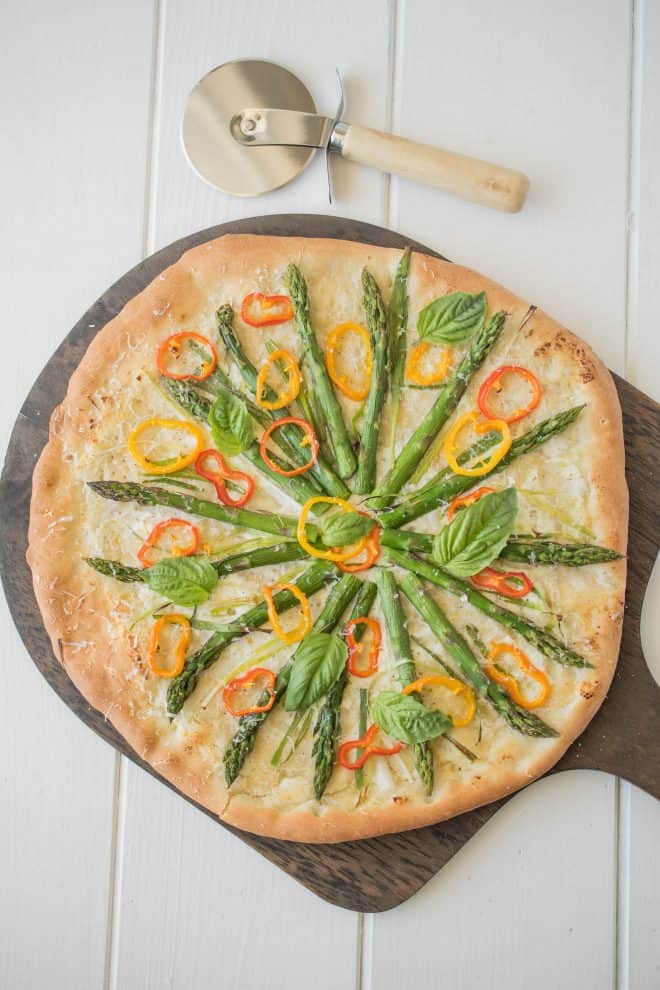 The pizza viewed from overhead showing the pretty vegetable topping