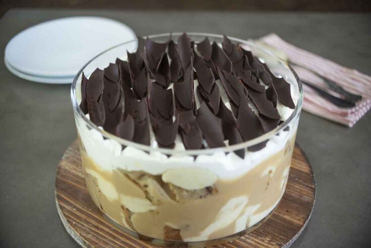 A sticky toffee pudding trifle topped with chocolate shavings