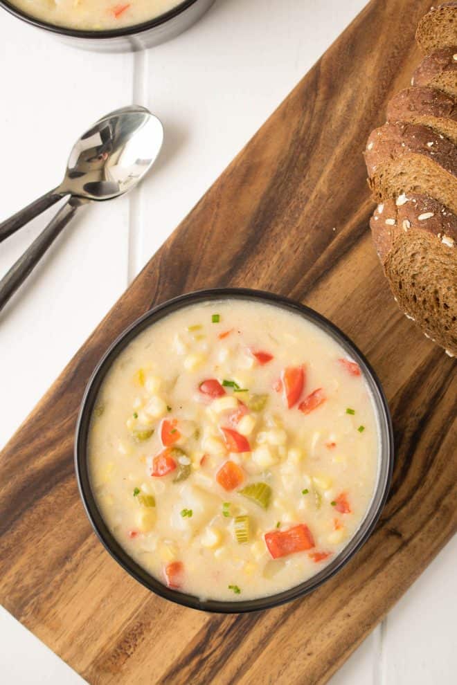 A view from overhead showing the vibrant colors of the corn, red pepper and celery in Summer Corn Chowder