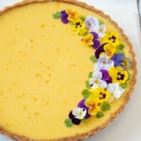 Flecks of orange zest can be seen in the mango topping