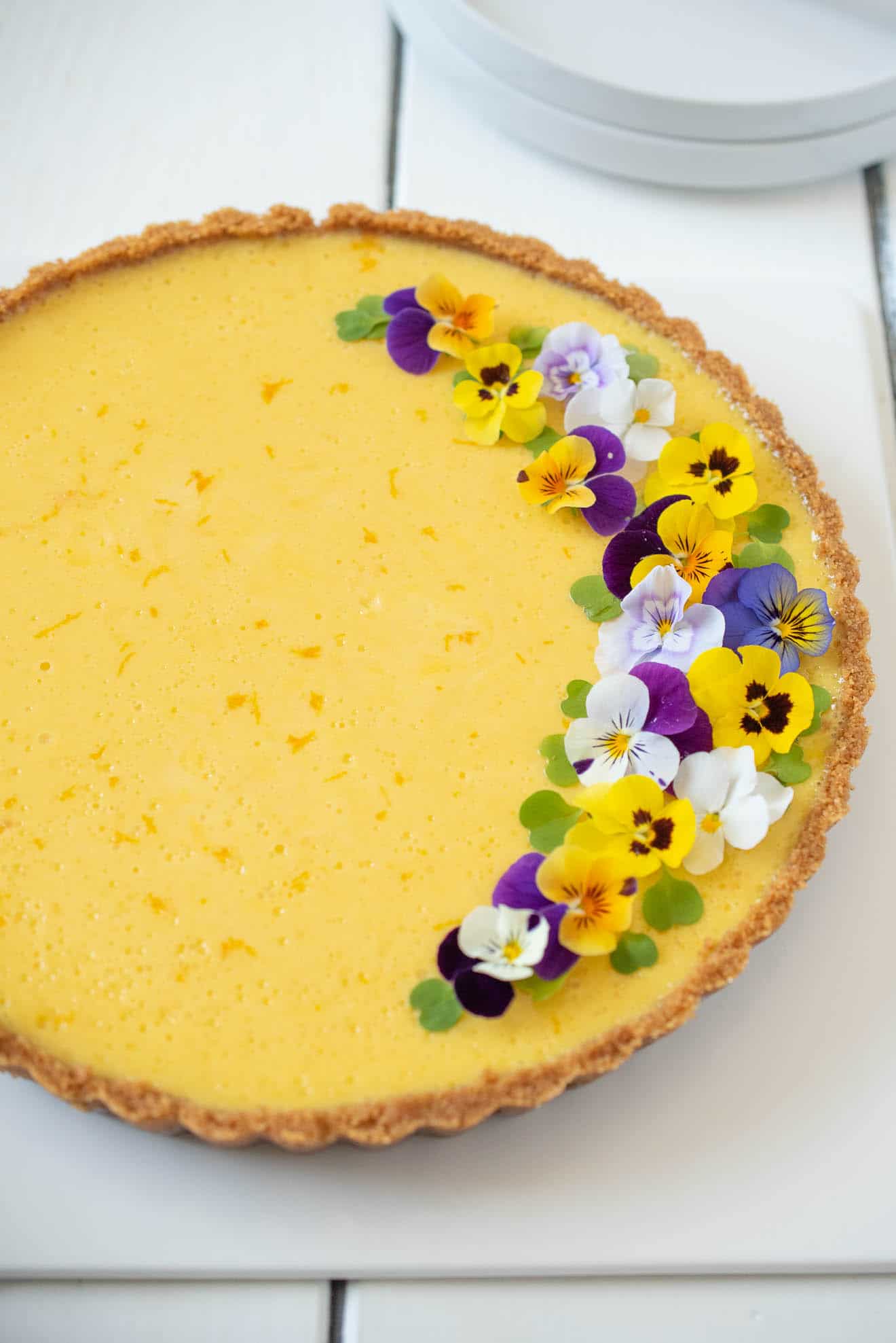 Flecks of orange zest can be seen in the mango topping