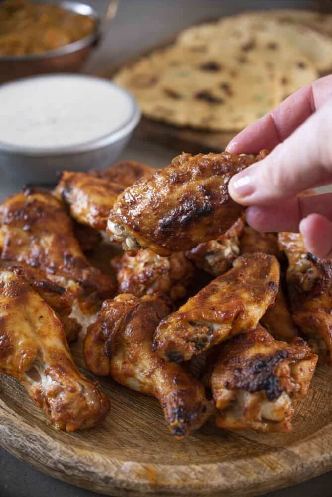 Holding a chicken wing