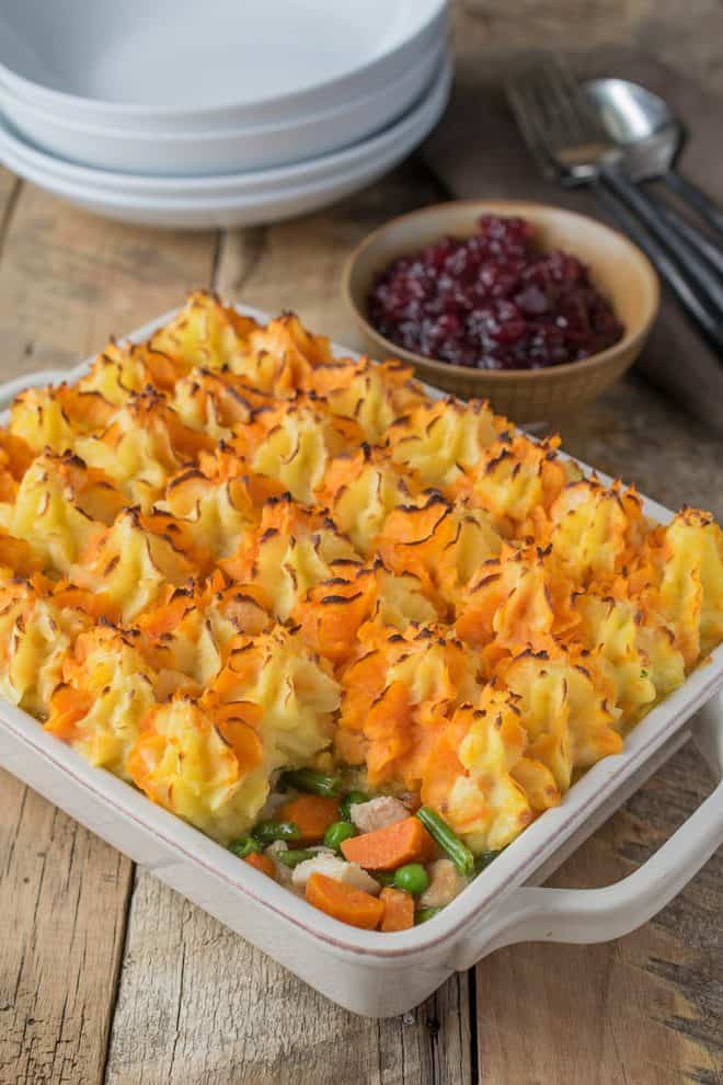 Turkey and vegetables topped with colorful mashed potato