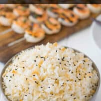Black sesame seeds garnish a bowl of rice