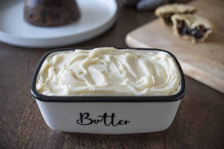 A rectangle butter dish filled with brandy butter