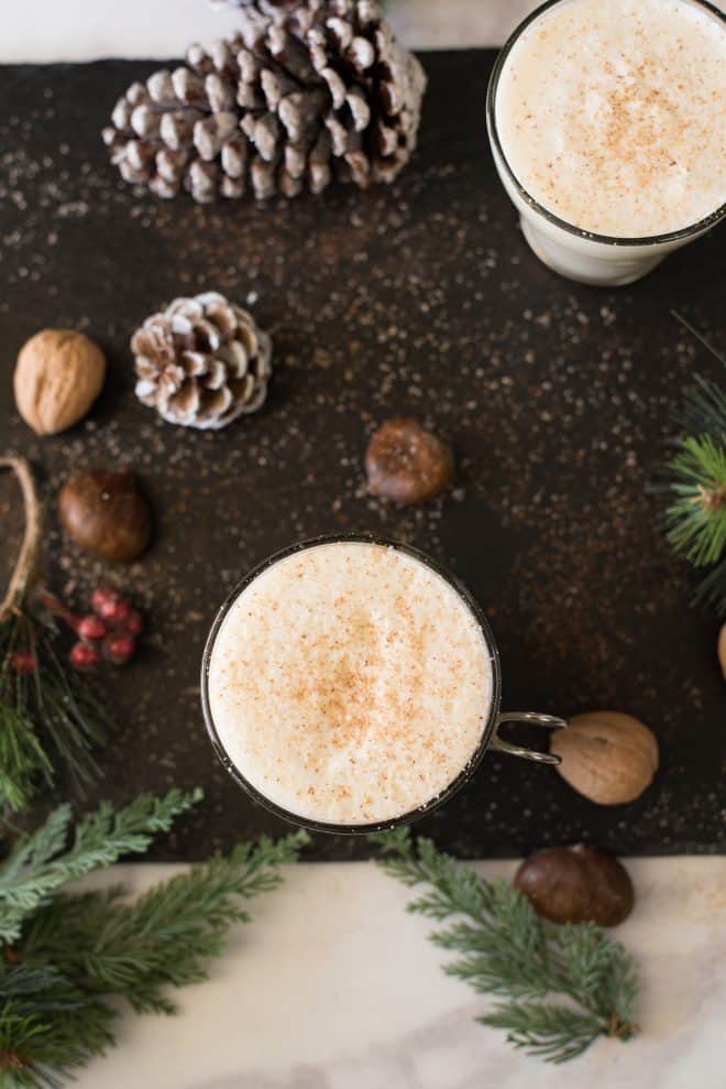 Eggnog viewed from overhead showing the grated nutmeg topping