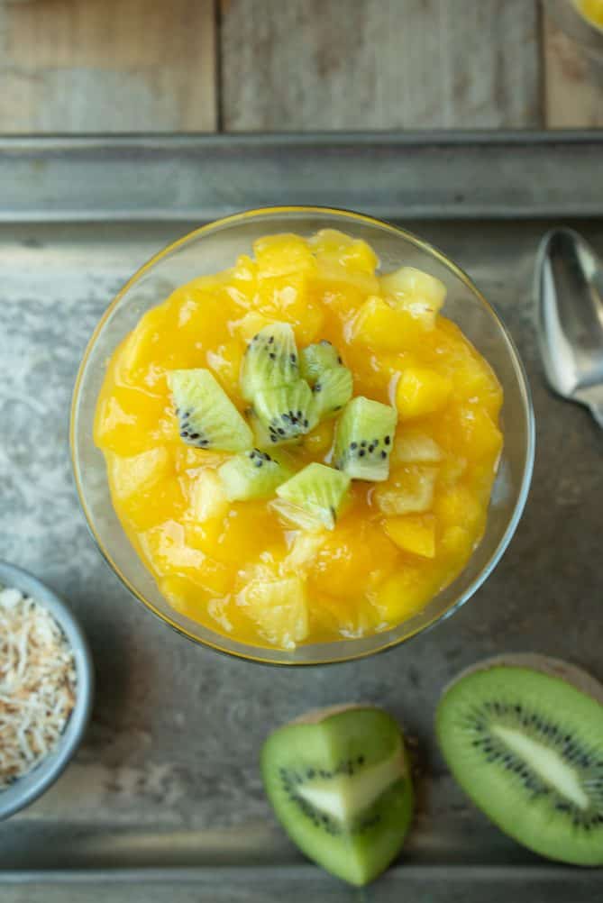 Viewed from overhead showing the vibrant mango, pineapple and kiwi toppings
