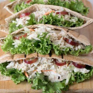 A closeup showing the crisp lettuce, tuna filling and sweet slices of grape