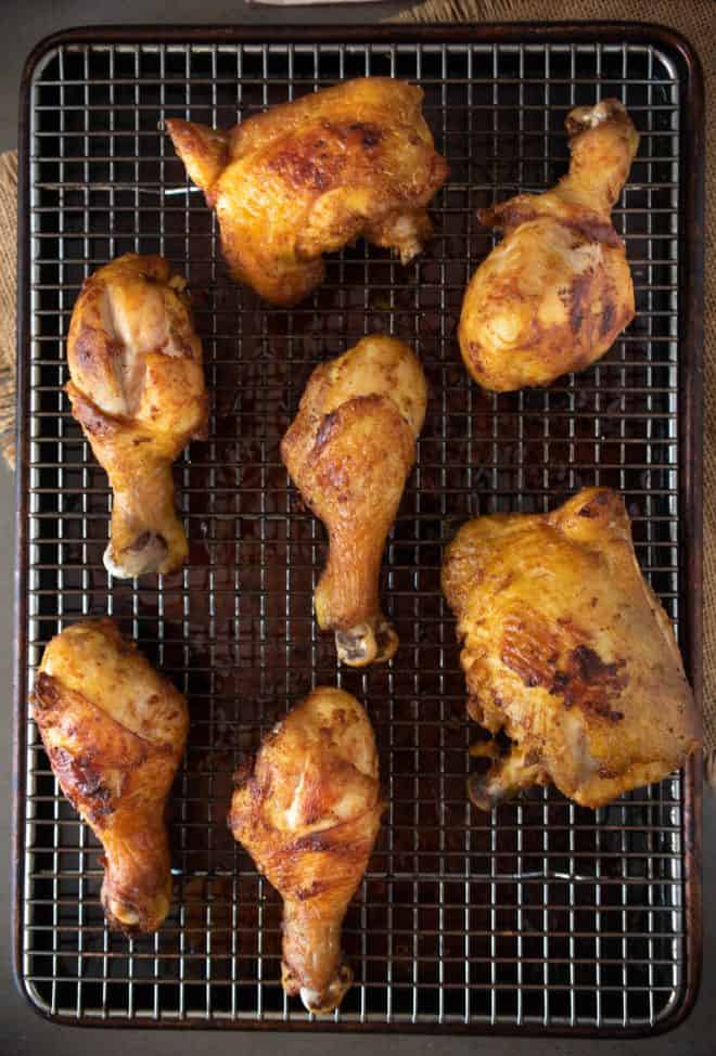 Freshly fried Turmeric Spiced Fried Chicken on a cooling rack