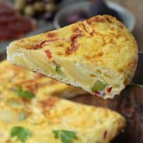 A slice of Vegetable Spanish Omelette Tortilla showing the filling
