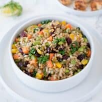 Farro grains mixed with colorful vegetables in a bowl