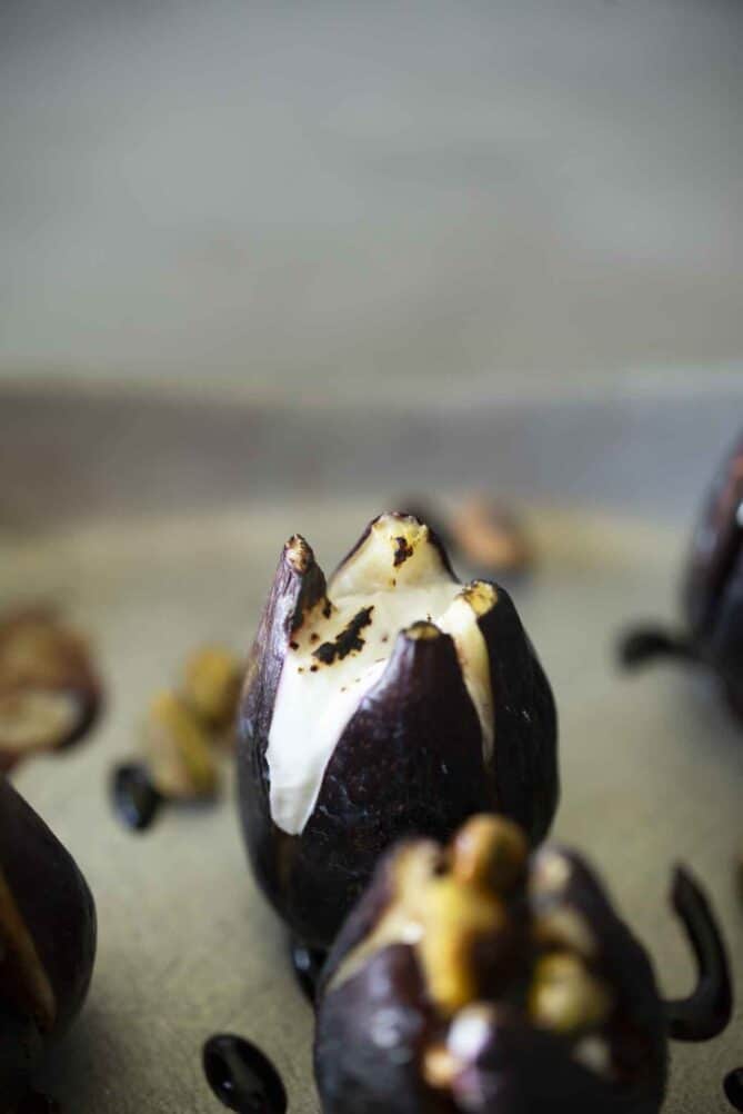 Browned goat cheese inside a fig
