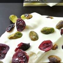 Dried cranberries, roasted pistachios are turned into Christmas bark with hardened white chocolate