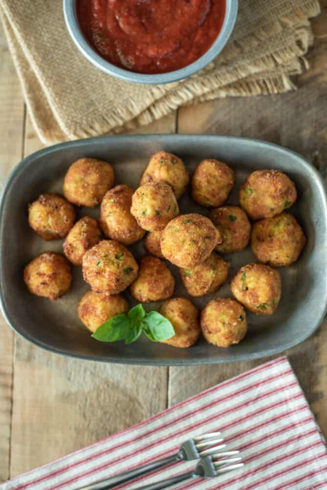 Zucchini and mortadella croquettes on a plate